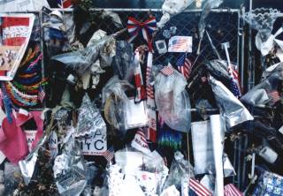 Photo by Duane Ruth-Heffelbower of remembrances left on the fence surrounding ground zero in NYC January 2002. - jpg - 20762 Bytes